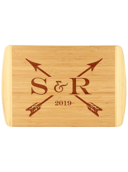 Initials & arrows custom bamboo cutting board is laser engraved with custom initials and established year.  Uniquely designed custom cutting board.
