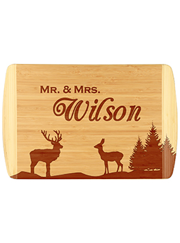 Unique buck, doe and tree bamboo cutting board.  Customize with your last name.  Laser engraved for detailed look and quality.