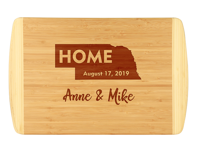 State outline and home design custom cutting board.  Established date and custom names make this bamboo cutting board a unique and fun gift or present.