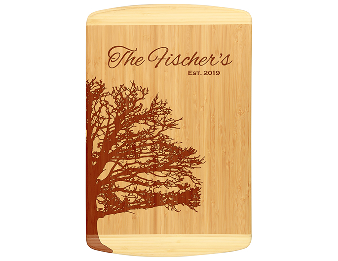 Unique bamboo cutting board design shows family tree outline and personalized with family name and established date.  Laser engraved for detailed look.