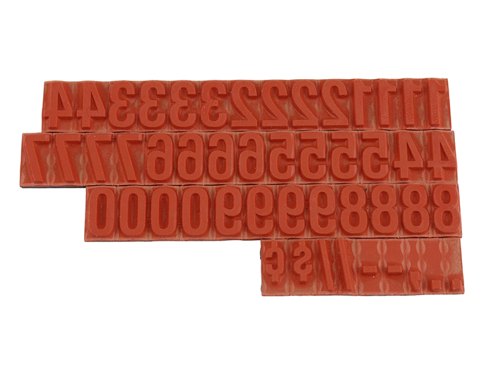 RIBtype FU75 bold number set.  This set of RIBtype characters comes with 49 total pieces.  3 ribs on the back of numbers and special characters.  Characters are 3/8" tall which is equivalent to 36pt font size.