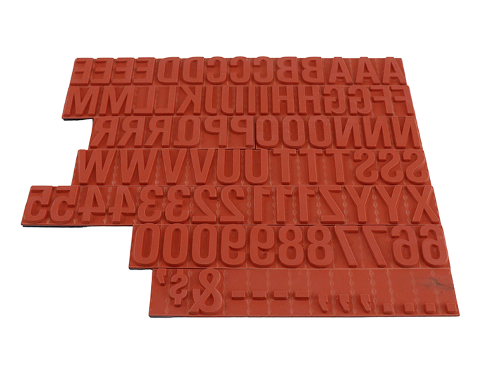 TU77 RIBtype bold letter / number set.  This set of RIBtype characters comes with 94 total pieces.  5 ribs on the back of characters and numbers.  Characters are 5/8" tall which is equivalent to 64pt font size.