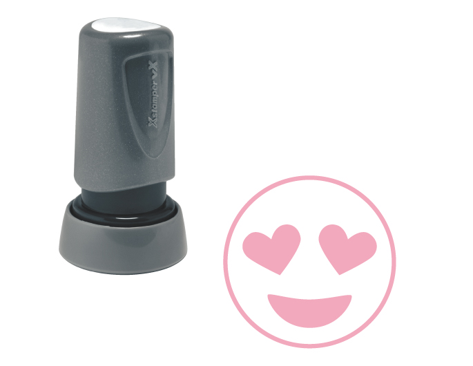 The Xstamper Xpression stock stamp features a happy face with heart eyes.  Impression size is roughly 7/8" diameter.  The stamp is re-inkable with oil based Xstamper ink.